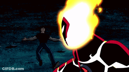 A Man In A Black Shirt Stands In Front Of A Cartoon Character With A Fire Head GIF