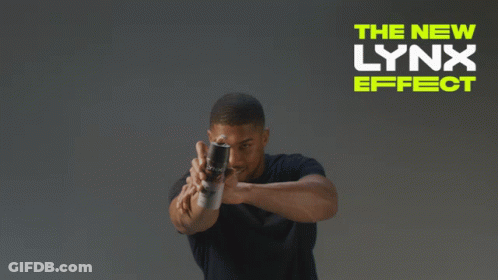 A Man In A Black Shirt Stands In Front Of A Sign That Says " The New Lynx Effect " GIF