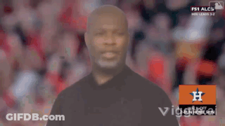 A Man In A Black Shirt Stands In Front Of An Orange H Logo GIF