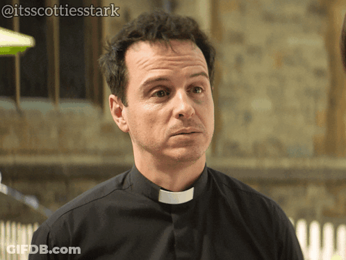 A Man In A Black Shirt With A White Collar Has The Hashtag @Itsscottiesstark On The Bottom Right Corner GIF