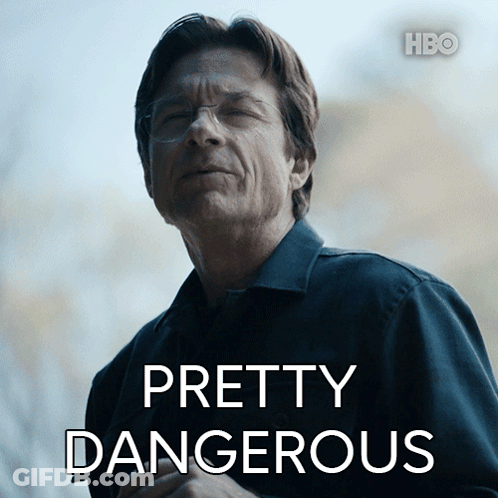 A Man In A Black Shirt With Pretty Dangerous Written On It GIF
