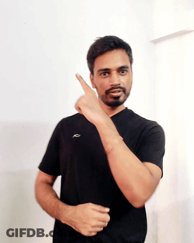 A Man In A Black Shirt With The Letter R On The Front GIF