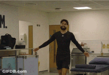 A Man In A Black Shirt With The Number 24 On His Chest GIF