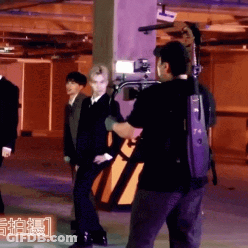 A Man In A Black Shirt With The Number T4 On The Back GIF