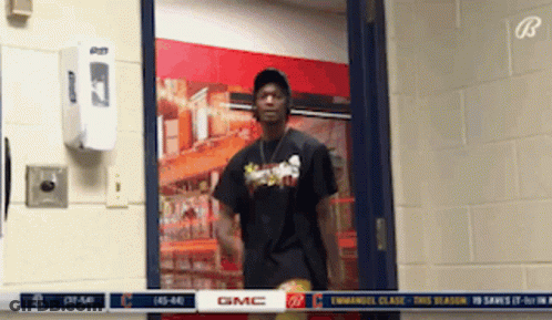 A Man In A Black Shirt With The Word Gmc On The Front GIF
