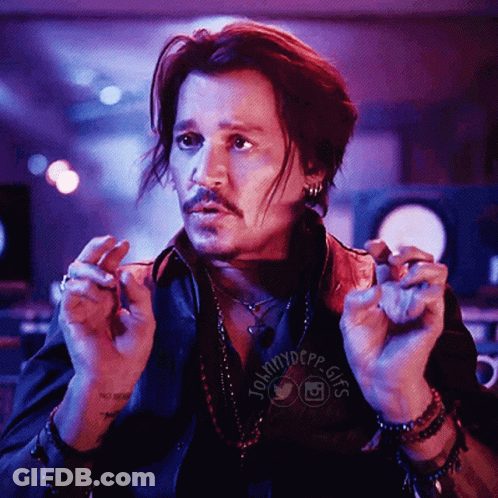 A Man In A Black Shirt With The Word Johnny Depp On It GIF