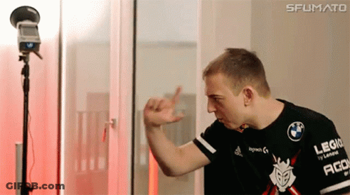 A Man In A Black Shirt With The Word Logitech On It Is Standing In Front Of A Microphone . GIF