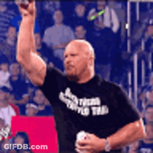 Man In Black Shirt With Team Holding Soda GIF