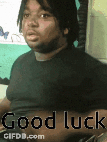 A Man In A Black Shirt With The Words Good Luck On The Bottom GIF