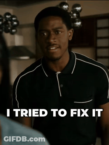 A Man In A Black Shirt With The Words I Tried To Fix It Above Him GIF