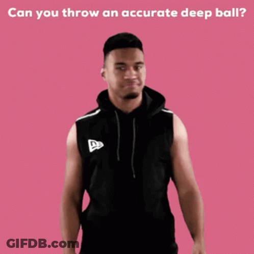 A Man In A Black Sleeveless Hoodie Stands In Front Of A Pink Background With The Words Can You Throw GIF