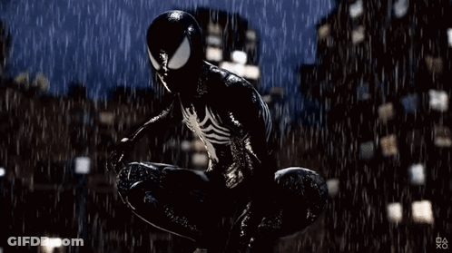 A Man In A Black Spiderman Suit Is Jumping In The Rain . GIF