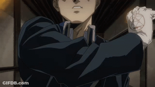 A Man In A Black Suit Is Holding A Pentagram In His Hand GIF