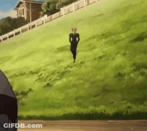 A Man In A Black Suit Is Running Up A Hill GIF