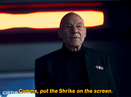 A Man In A Black Suit Says Comms Put The Shrike On The Screen GIF