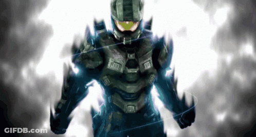 A Man In A Black Suit With A Yellow Helmet Is Standing In Front Of A White Background GIF