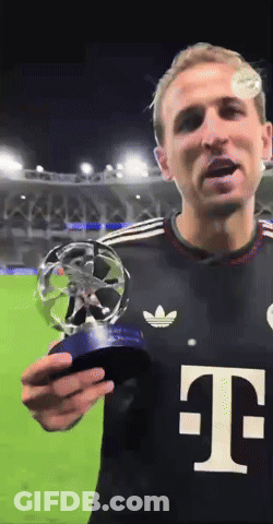A Man In A Black T-Mobile Shirt Holds A Trophy GIF