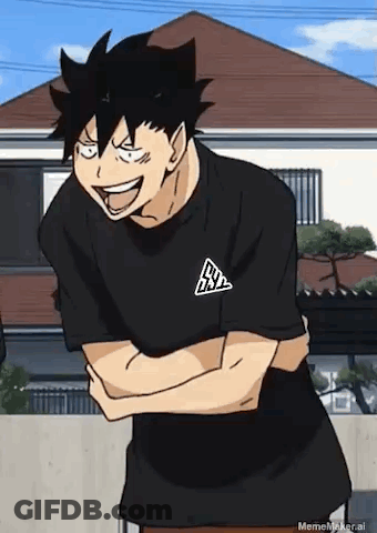 A Man In A Black T-Shirt Is Laughing With His Arms Crossed In Front Of A House . GIF
