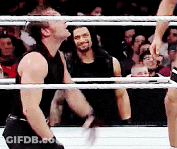 A Man In A Black Tank Top Is In A Boxing Ring GIF