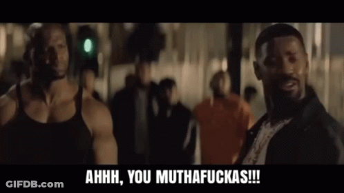 A Man In A Black Tank Top Is Laughing And Says Ahhh You Muthafuckas GIF