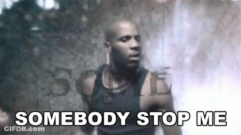 A Man In A Black Tank Top Is Standing In Front Of A Waterfall And Says `` Somebody Stop Me '' . GIF