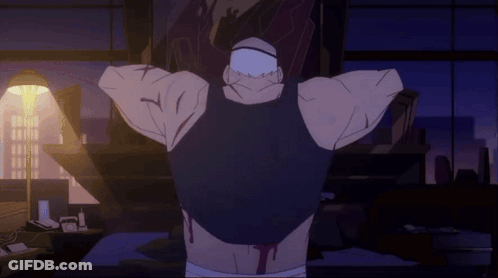 A Man In A Black Tank Top Is Standing With His Arms Outstretched In A Dark Room GIF