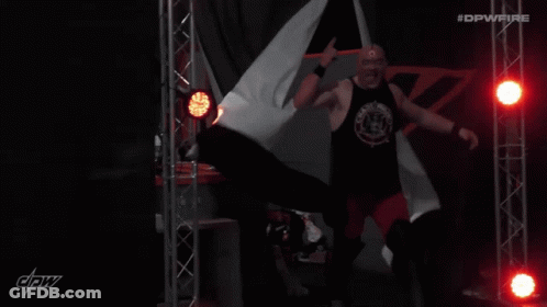 A Man In A Black Tank Top With The Name Luther Written On It GIF