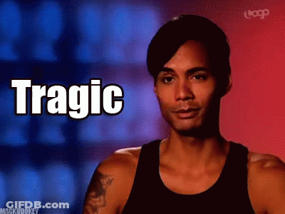 A Man In A Black Tank Top With The Word Tragic Written On It GIF