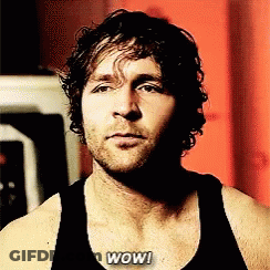 A Man In A Black Tank Top With The Word Wow Written On His Chest GIF