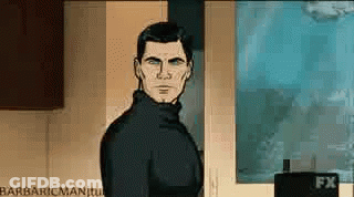 A Man In A Black Turtleneck Is Standing In Front Of A Wall With A Poster On It . GIF