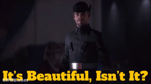 A Man In A Black Uniform With The Words It 'S Beautiful Isn 'T It On The Bottom GIF