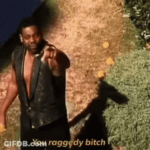 A Man In A Black Vest Is Pointing At The Camera And Saying `` You Raggedy Bitch '' . GIF