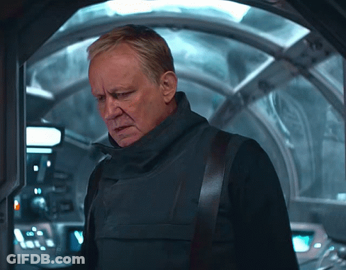 Man In Black Vest In Front Of Glass Door GIF
