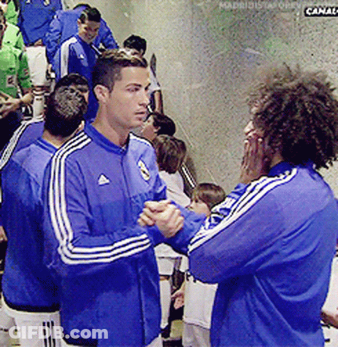 A Man In A Blue Adidas Jacket Talks To Another Man In A Blue Adidas Jacket GIF
