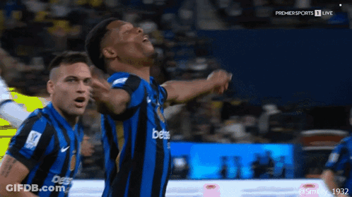 A Man In A Blue And Black Striped Jersey With The Word Bets On It GIF