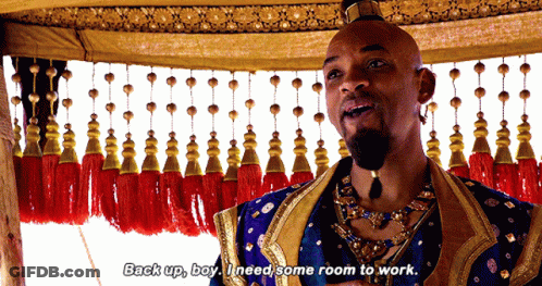A Man In A Blue And Gold Costume Says " Back Up Boy I Need Some Room To Work " GIF