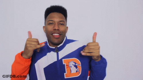 A Man In A Blue And Orange Jacket With The Letter D On It GIF