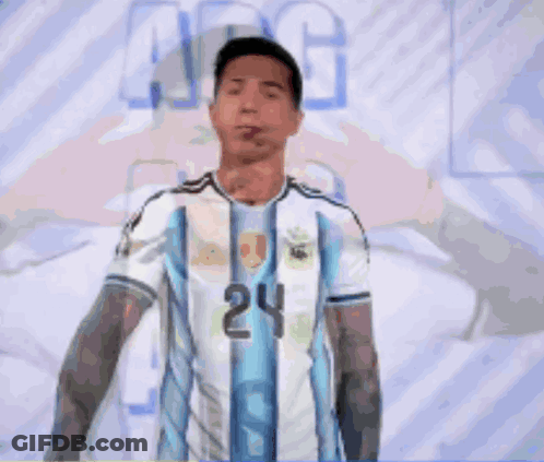 A Man In A Blue And White Jersey With The Number 24 Pointing At The Camera GIF
