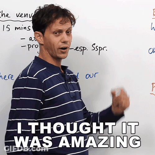 Man In Blue And White Striped Shirt In Front Of Whiteboard GIF