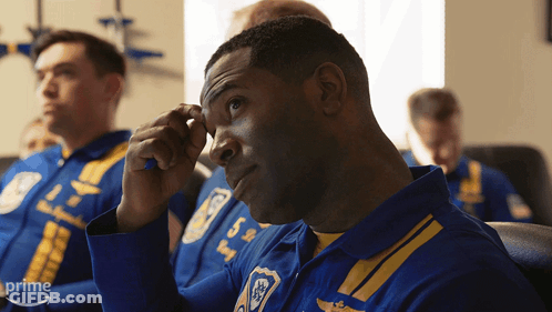 A Man In A Blue And Yellow Uniform Has The Number 5 On His Shirt GIF