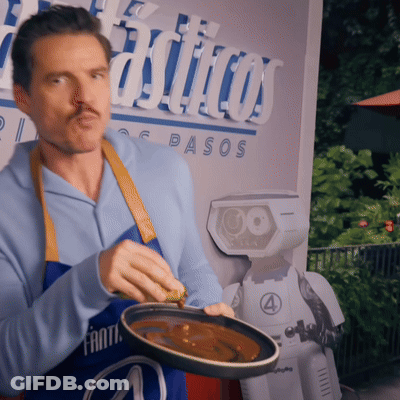 A Man In A Blue Apron Is Holding A Pan Of Food In Front Of A Sign That Says Pasos GIF