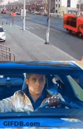 A Man In A Blue Car Looking Out The Window GIF