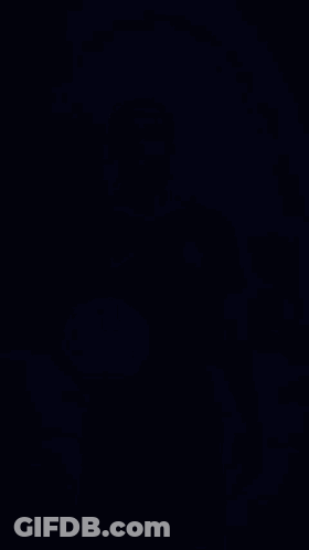 A Man In A Blue Chelsea Jersey Is Holding A Soccer Ball . GIF