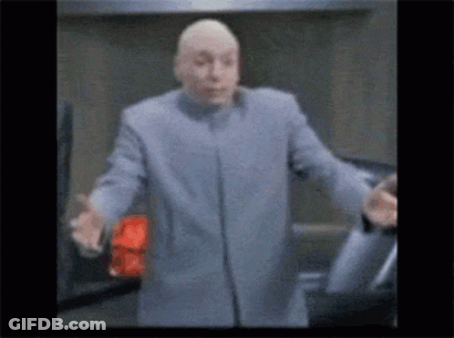 Man In Blue Coat Stands In Front Of Car With Outstretched Arms GIF