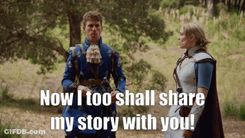 A Man In A Blue Coat Is Talking To A Woman In A White Dress GIF