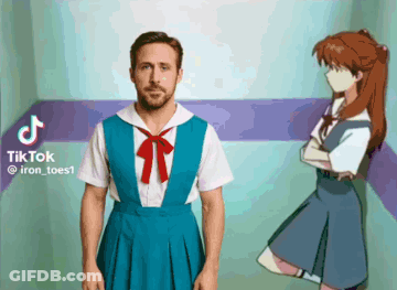 A Man In A Blue Dress Is Standing Next To A Girl In A Blue Dress GIF