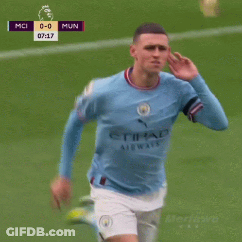 A Man In A Blue Etihad Airways Jersey Holds His Finger To His Mouth GIF