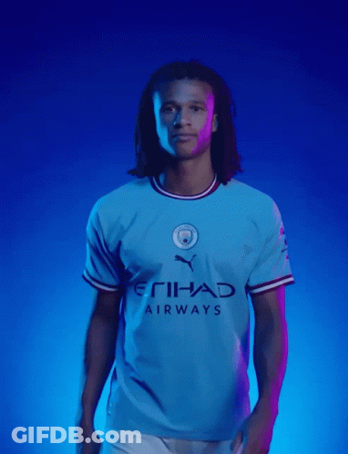 A Man In A Blue Etihad Airways Shirt GIF