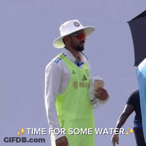 A Man In A Blue Hat Is Talking To Another Man In A White Shirt With The Words Time For Some Water On The Bottom GIF