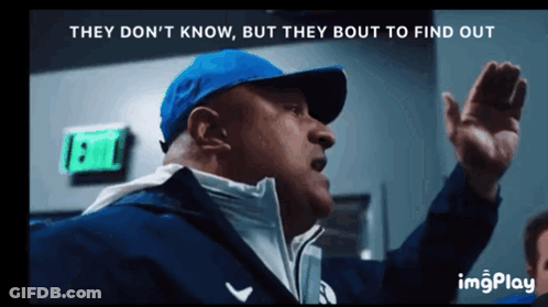 A Man In A Blue Hat Says They Don 'T Know But They Bout To Find Out In Front Of An Exit Sign GIF